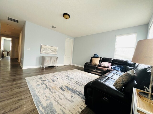 living room featuring dark hardwood / wood-style floors