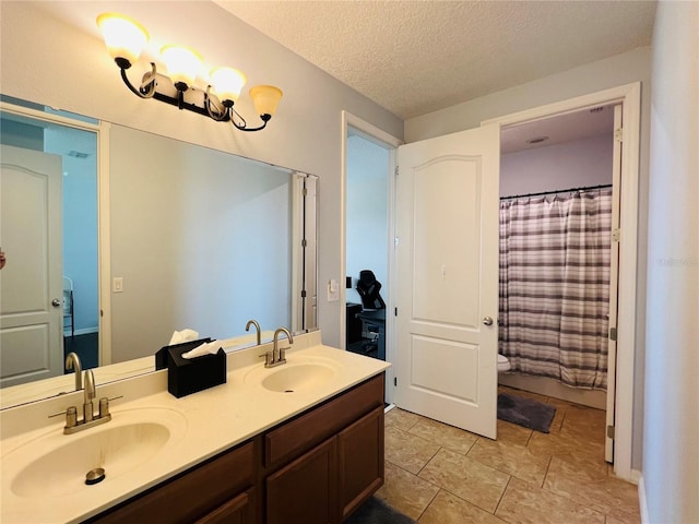 bathroom with vanity, a textured ceiling, and a shower with shower curtain