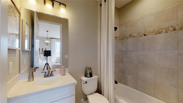 full bathroom featuring vanity, shower / bathtub combination with curtain, and toilet