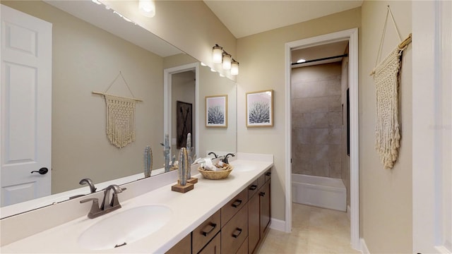 bathroom with vanity and tiled shower / bath