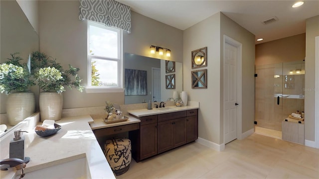 bathroom featuring a shower with door and vanity