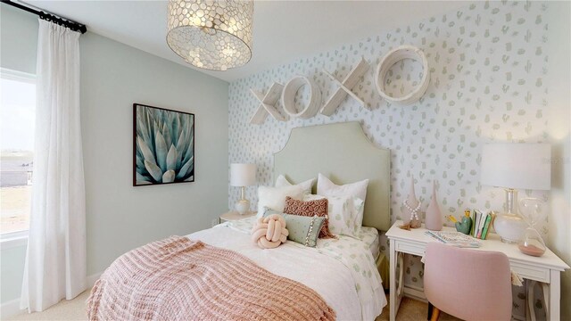 bedroom with a notable chandelier