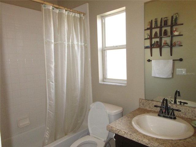 full bathroom with shower / bath combo, vanity, and toilet