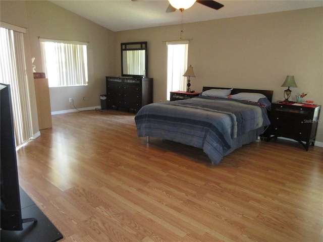 bedroom featuring vaulted ceiling, ceiling fan, and light hardwood / wood-style floors