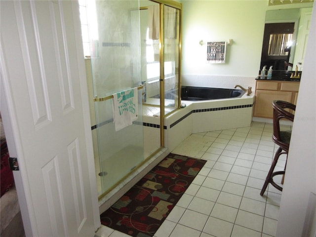 bathroom with tile patterned flooring and plus walk in shower