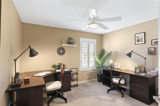 office area featuring light colored carpet and ceiling fan