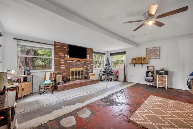 living room with ceiling fan and a fireplace