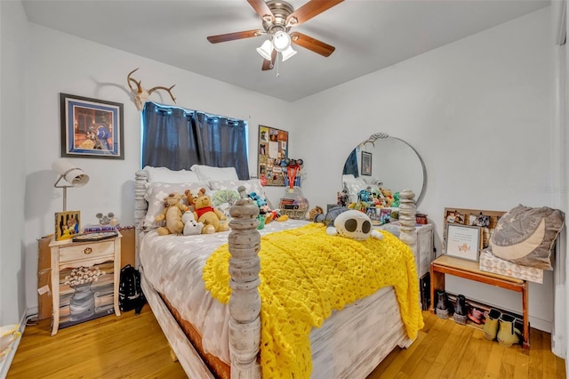 bedroom with wood-type flooring and ceiling fan