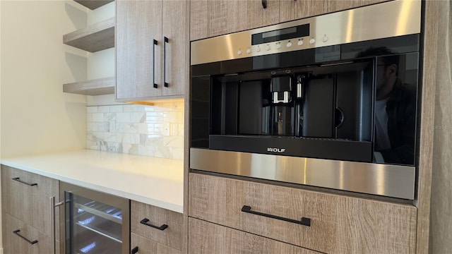 room details featuring tasteful backsplash, wine cooler, light countertops, light brown cabinetry, and open shelves