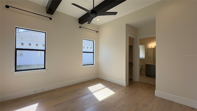 interior space with recessed lighting, light wood-style floors, a ceiling fan, beamed ceiling, and baseboards