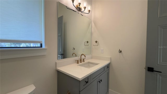 bathroom with vanity and toilet