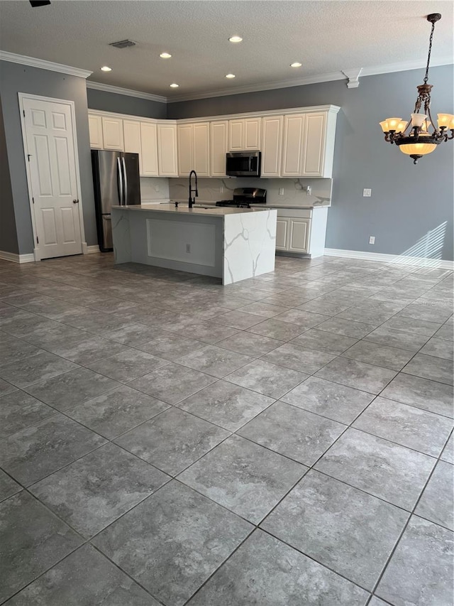 kitchen featuring stainless steel appliances, crown molding, and white cabinets