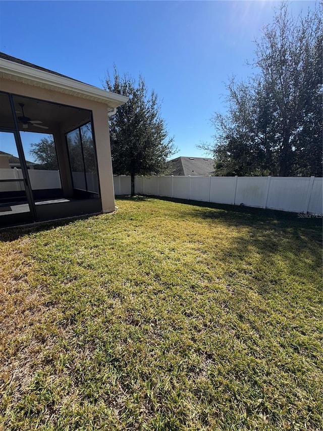 view of yard featuring a sunroom