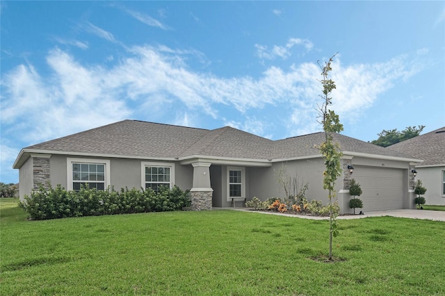 view of front of home with a garage and a front yard