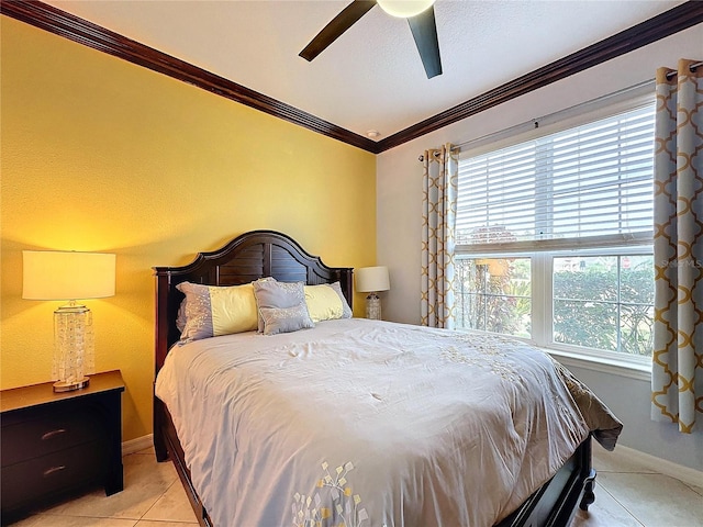 tiled bedroom with ceiling fan and ornamental molding