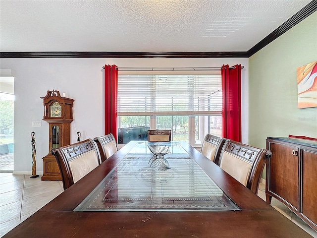 dining room featuring crown molding, light tile patterned floors, and a textured ceiling