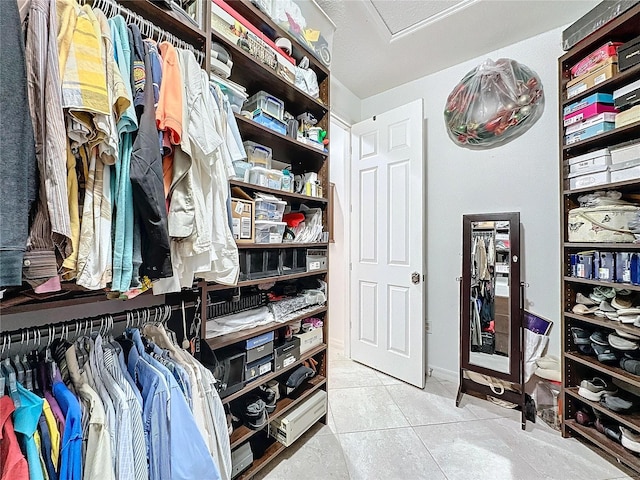 spacious closet with tile patterned flooring