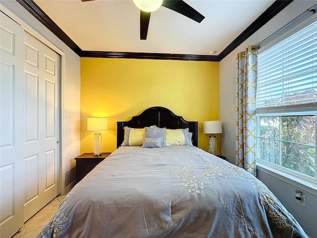 bedroom with ornamental molding and ceiling fan