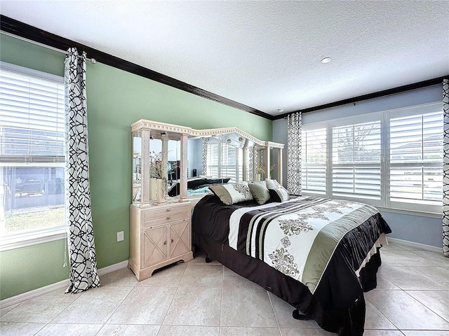 tiled bedroom featuring ornamental molding and a textured ceiling