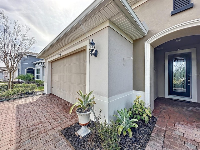 doorway to property featuring a garage