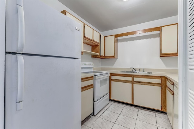 kitchen with sink, light tile patterned floors, and white appliances