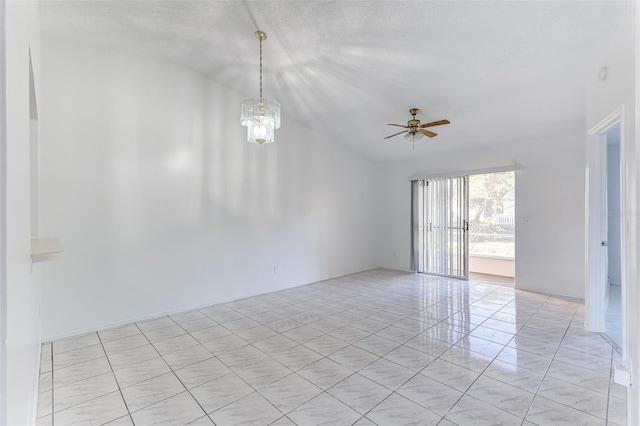 spare room featuring lofted ceiling and ceiling fan