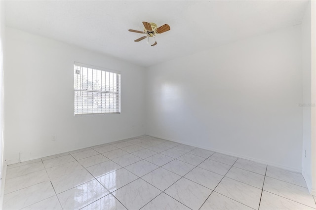 unfurnished room featuring light tile patterned floors and ceiling fan