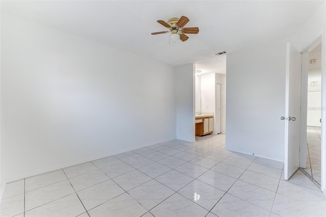 spare room featuring ceiling fan