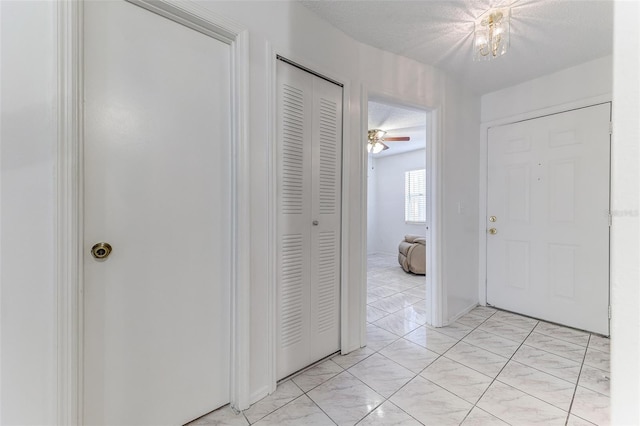 corridor with a textured ceiling