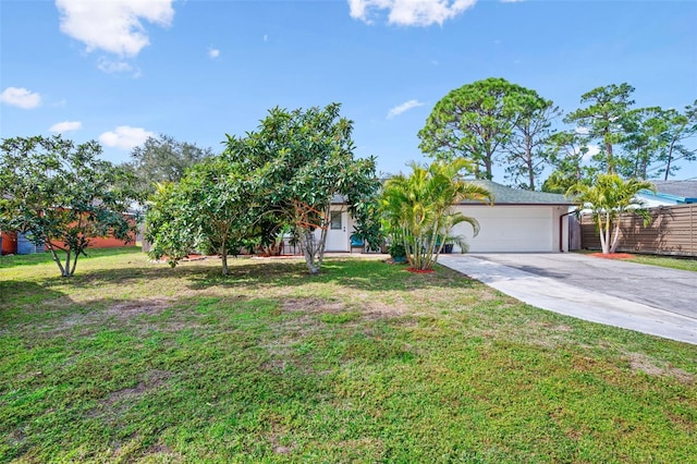 view of front of house with a garage and a front yard