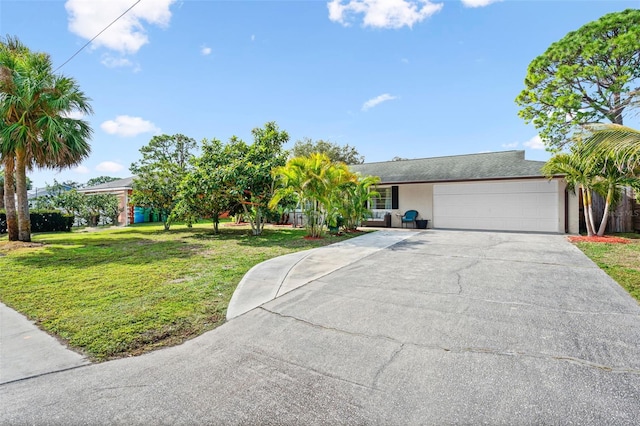 single story home with a garage and a front lawn