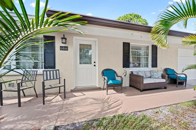 property entrance featuring a patio