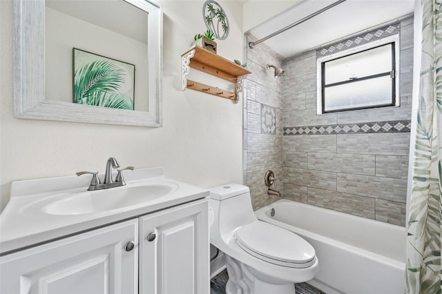 full bathroom with shower / tub combo with curtain, vanity, and toilet