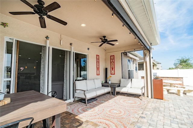 view of patio / terrace featuring ceiling fan and an outdoor living space