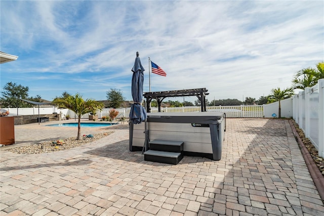 view of patio featuring a pool with hot tub and a pergola