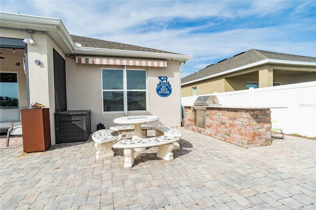 view of patio / terrace featuring an outdoor kitchen and area for grilling