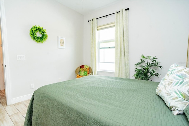 bedroom with light hardwood / wood-style floors