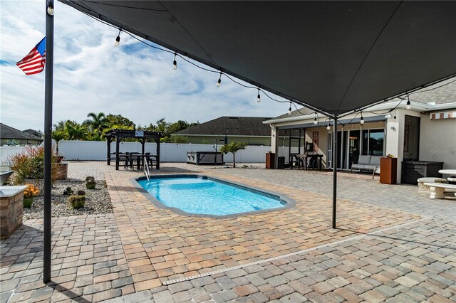 view of pool with a patio and a pergola