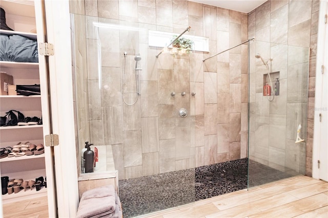 bathroom with a tile shower