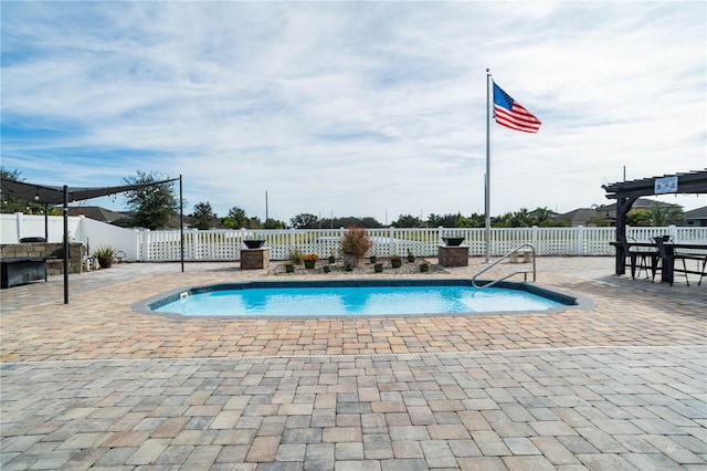 view of swimming pool featuring a pergola and a patio area