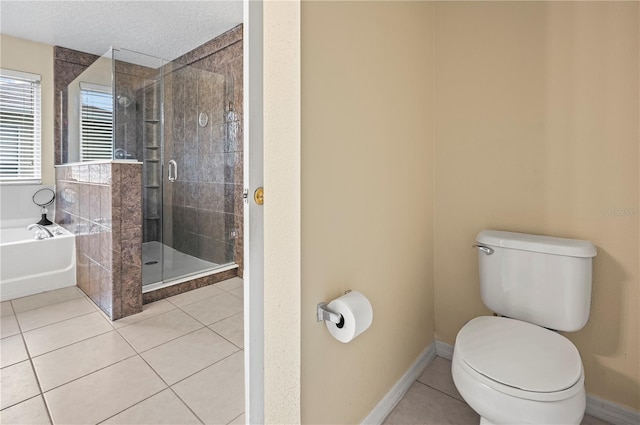 bathroom featuring independent shower and bath, tile patterned floors, a textured ceiling, and toilet