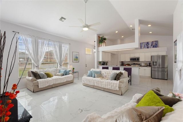 living room featuring ceiling fan and high vaulted ceiling