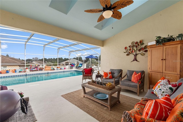 view of pool featuring a lanai, a patio area, and outdoor lounge area