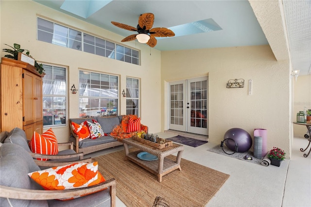 interior space featuring french doors, ceiling fan, and outdoor lounge area