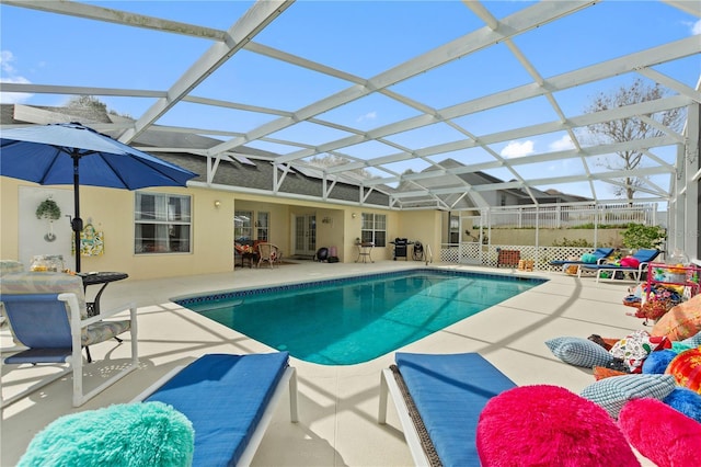 view of pool featuring a lanai and a patio area