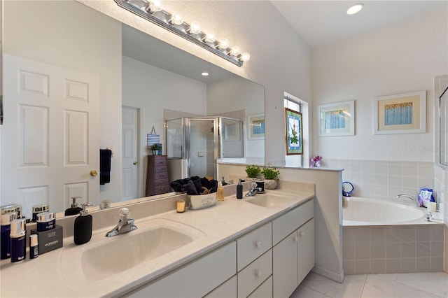 bathroom with vanity and plus walk in shower