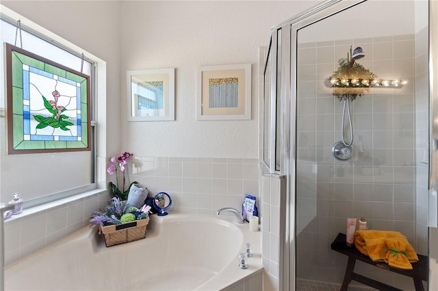 bathroom with shower with separate bathtub