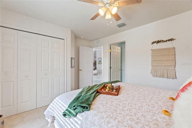 bedroom featuring ceiling fan, carpet flooring, and a closet