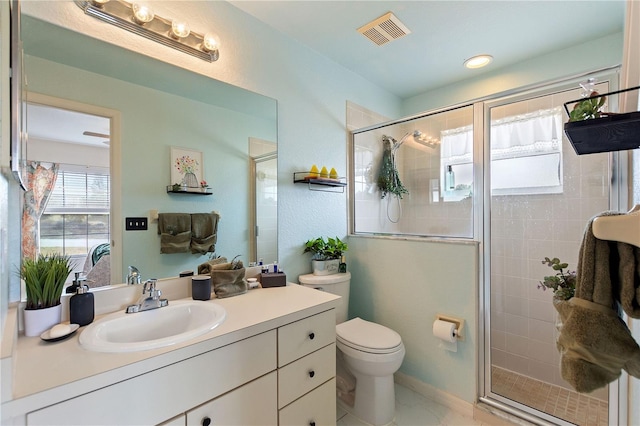 bathroom with vanity, toilet, and walk in shower