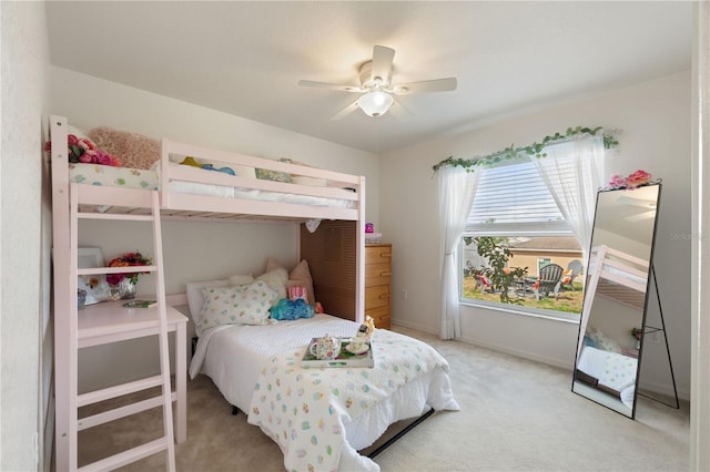 bedroom with ceiling fan and light carpet